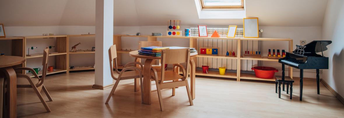 Table and desk in a top floor room used for teaching from home