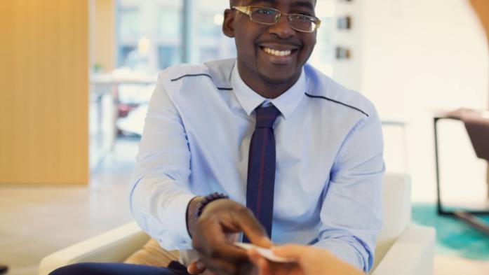 man giving out his business card