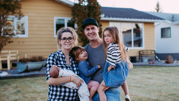 family outside a house
