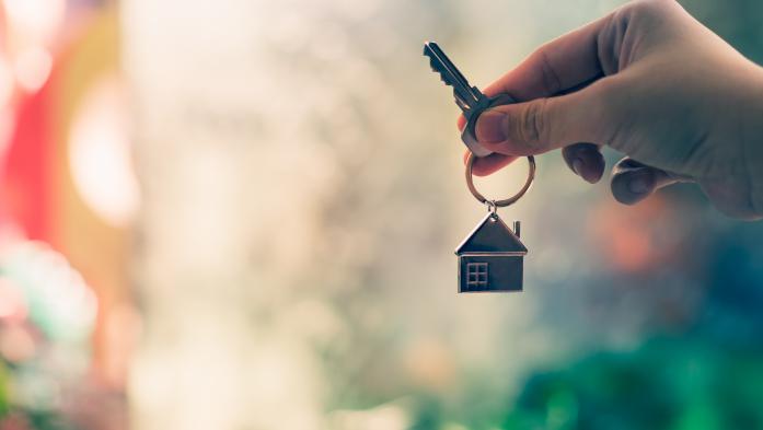 hand with house key