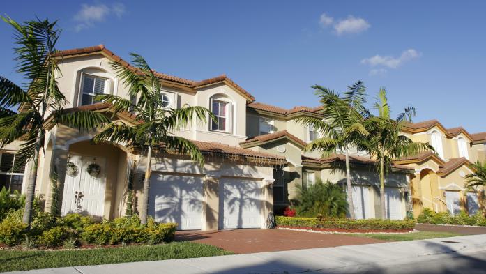 row of florida houses with palm trees