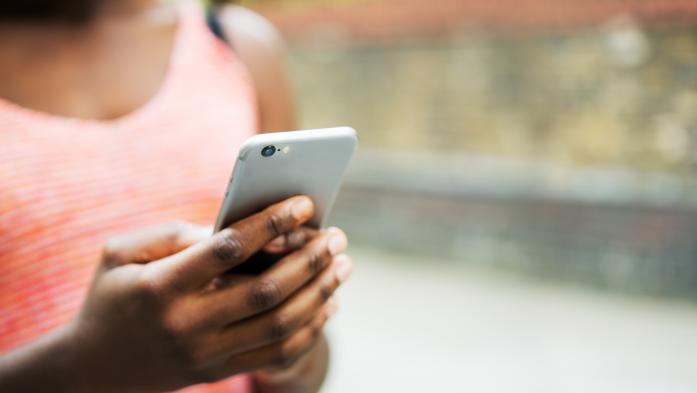 closeup of person's hand holding a cell phone