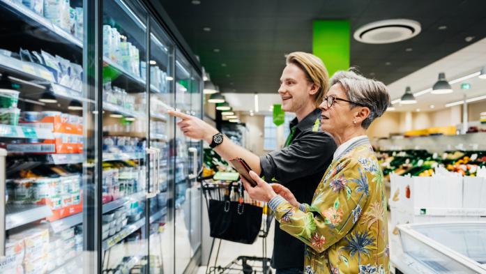 Grandmother and grandson shopping for groceries