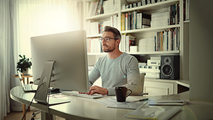 Photo of man working in home office space