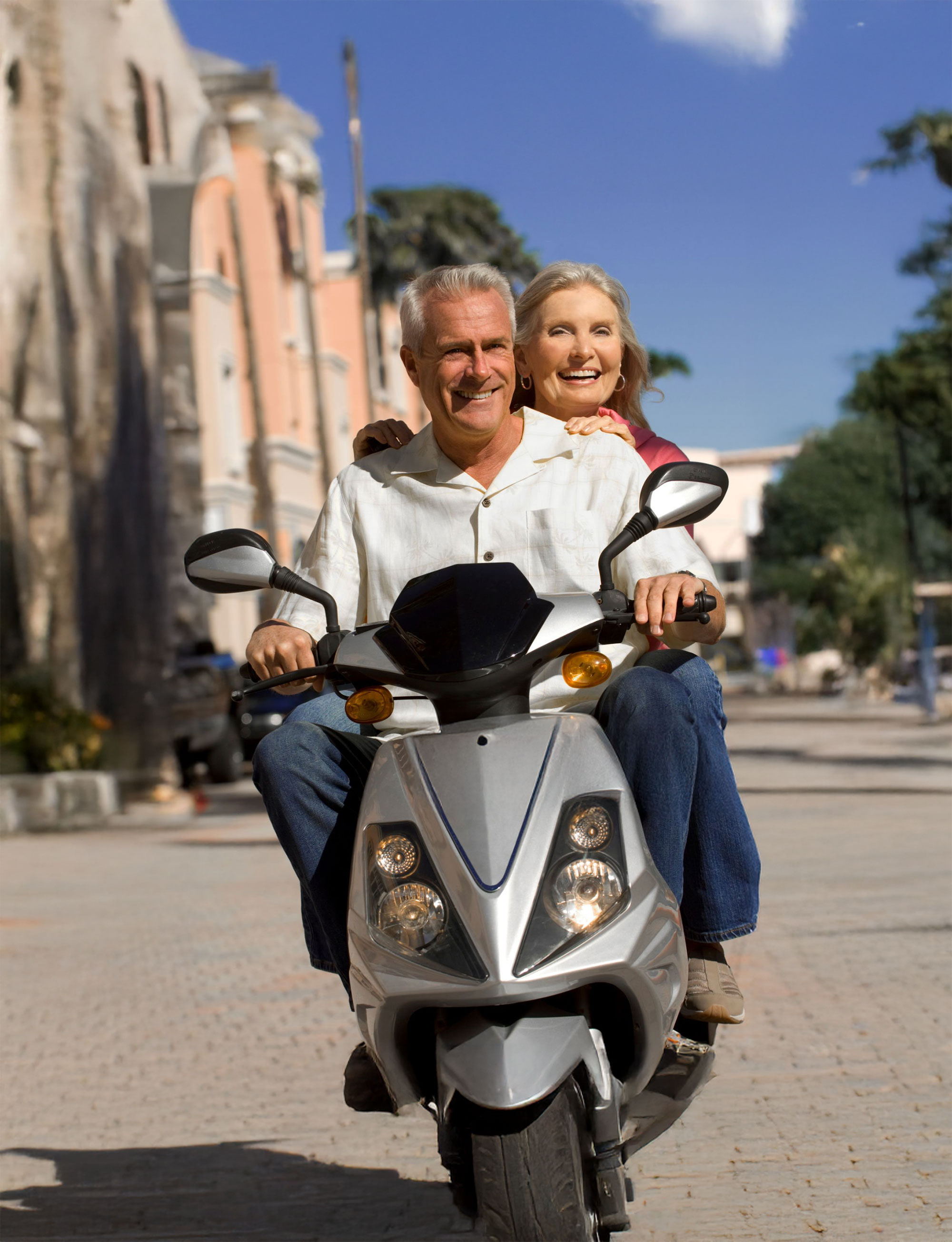 mature couple on a scooter