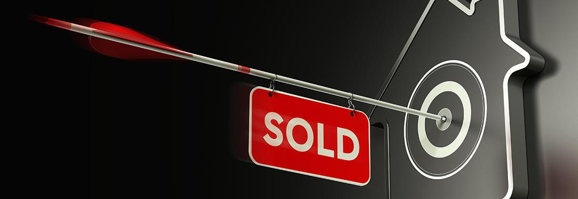 digital illustration of an arrow with a sold sign attached to it hitting a house target