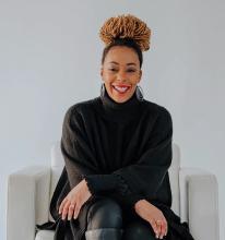 Photo of Kendall Bonner sitting on a white chair