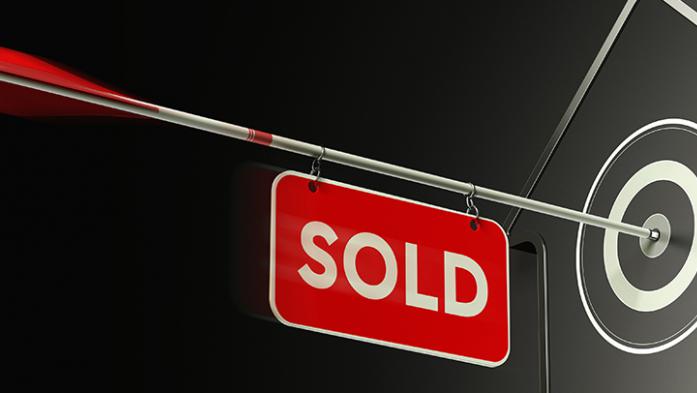 digital illustration of an arrow with a sold sign attached to it hitting a house target