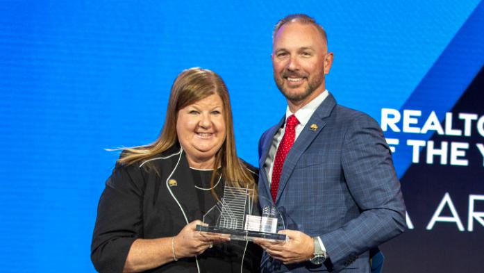 2024 Florida Realtors President Gia Arvin was awarded Realtor of the Year. Arvin is pictured with 2025 President Tim W.