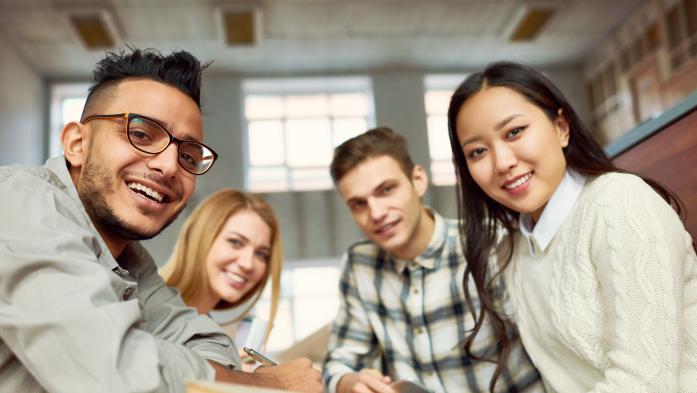smiling college students in library