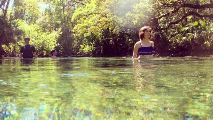 Girl wades in a Florida spring