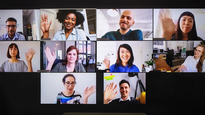 Photo of people waving a talking from their computers