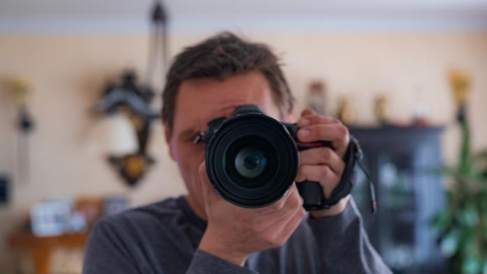 Camera faced toward viewer with living room in background